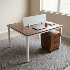 2-way open workstation featuring twin back-to-back dark walnut wood grain laminate desktops separated by a central translucent frosted glass privacy divider screen, two mobile lockable three-drawer storage pedestals with black curved handles, integrated desktop cable grommets, and a sturdy white powder-coated steel loop-leg frame equipped with floor-protective glides.